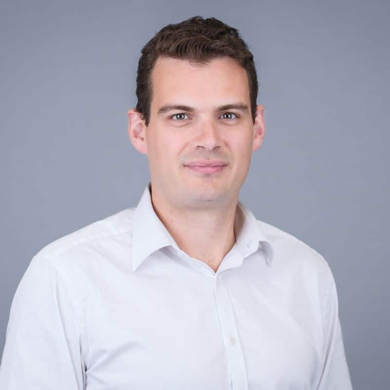 Person in white shirt, neutral background